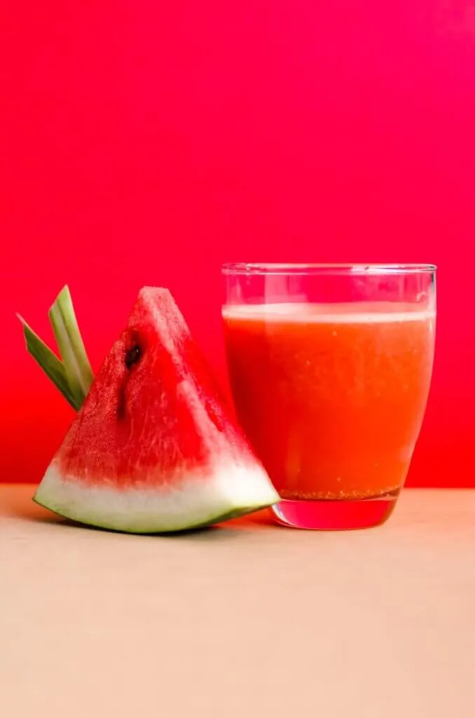 Kayanmata recipe: 5 baffling facts about Kayan Mata. 8 watermelon shake filled glass cup beside sliced watermelon fruit on brown surface