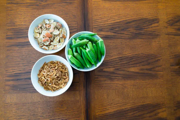 Ogbono soup benefits, ingredients and step-by-step recipe 15 the Ogbono seeds side by side with Crayfish and Okra