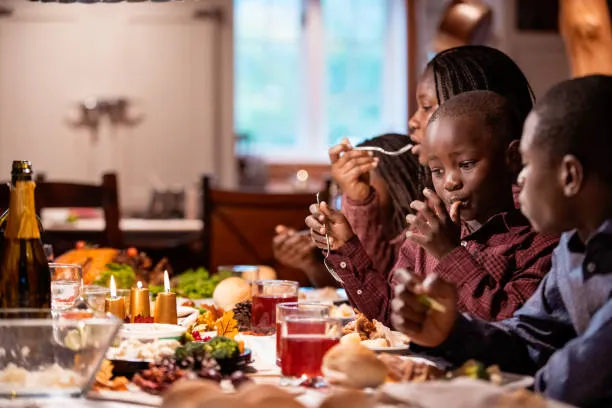 Ogbono soup benefits, ingredients and step-by-step recipe 8 Family enjoying Ogbono soup