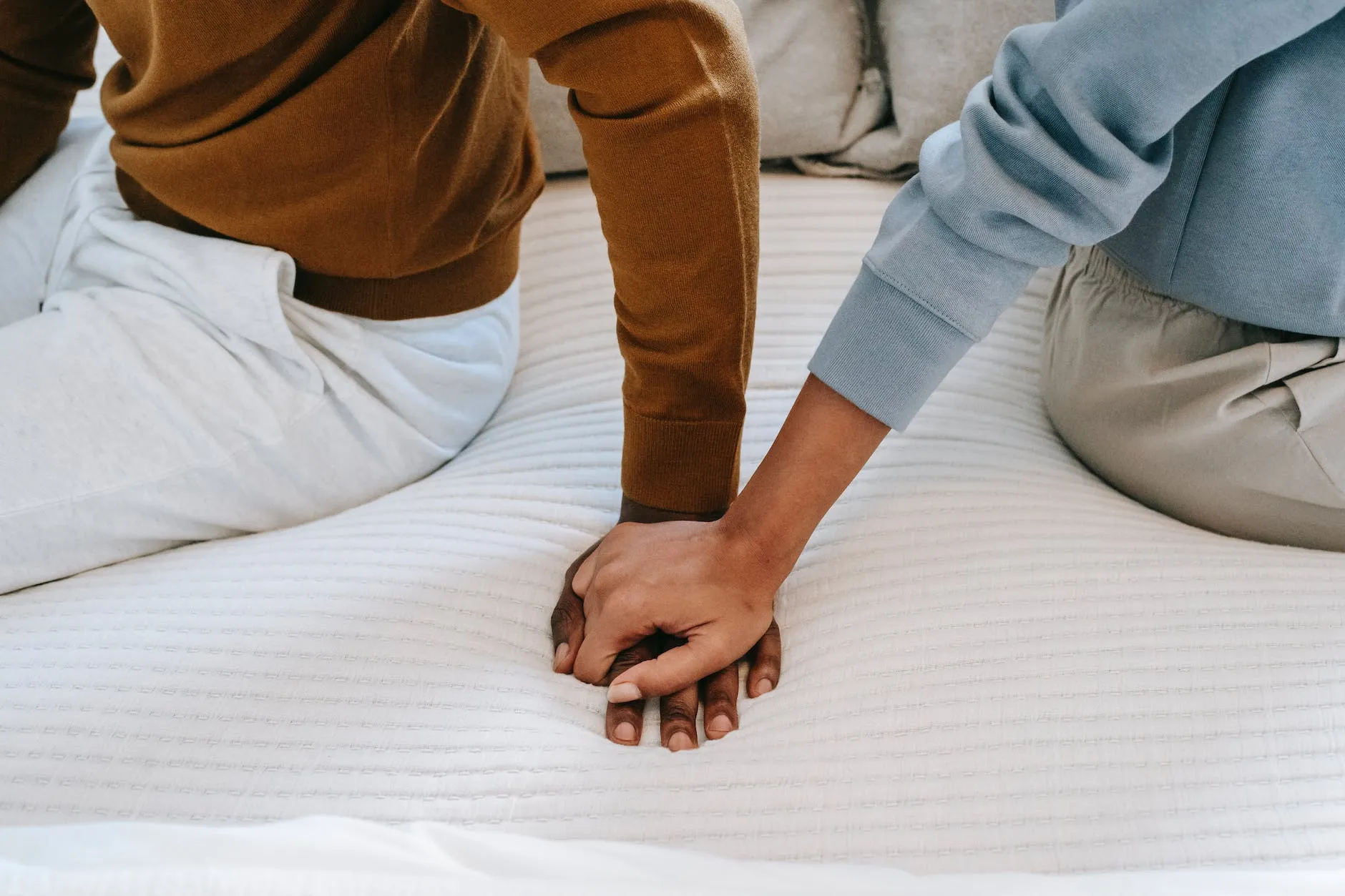 30+ Brilliant new month messages for your loved ones 12 crop unrecognizable black couple holding hands on bed
