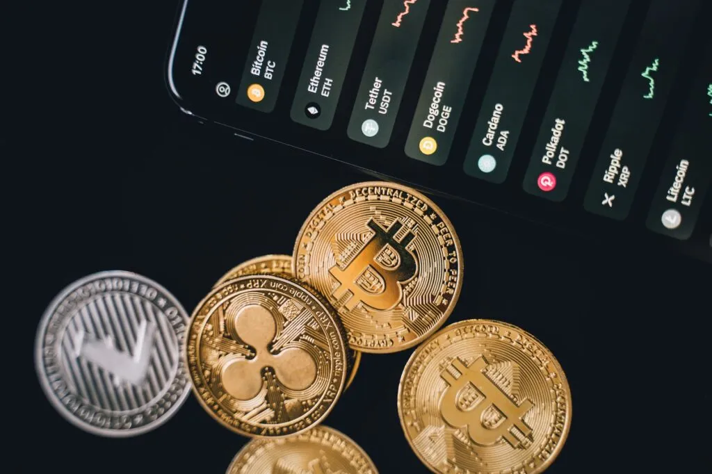 Top 5 cryptocurrency trends to expect in 2023 8 bitcoins beside a phone