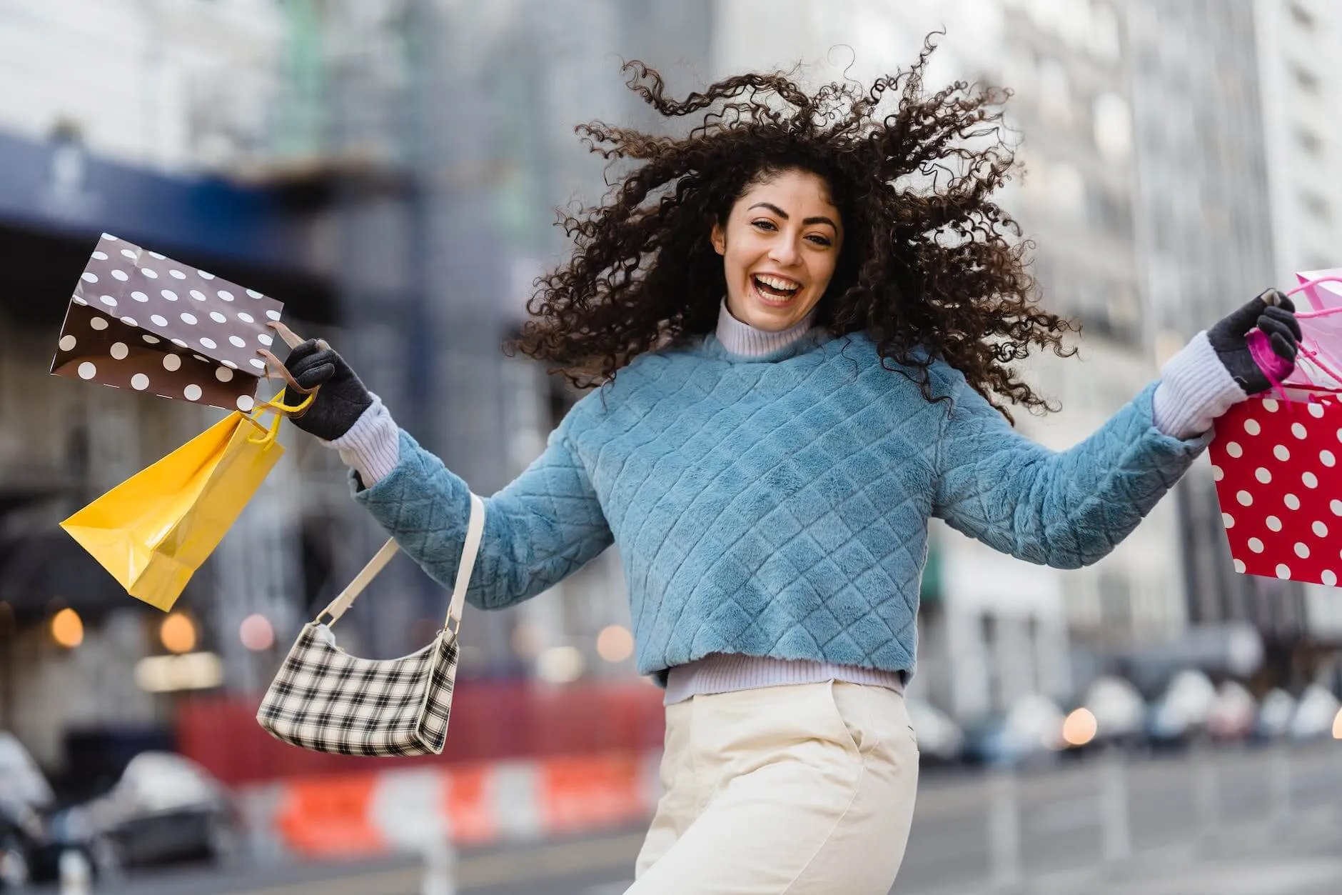 Content Marketing Trends For Staying Ahead In 2023 10 happy woman jumping with shopping bags