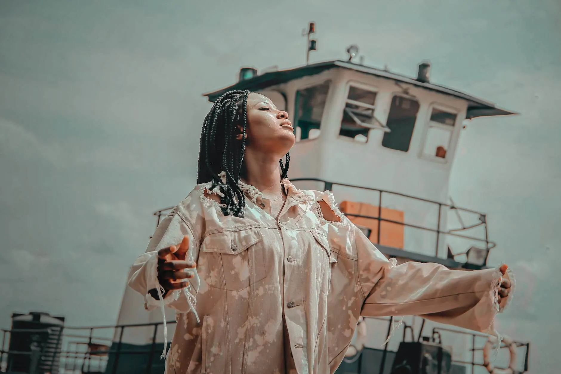 woman standing near white ship