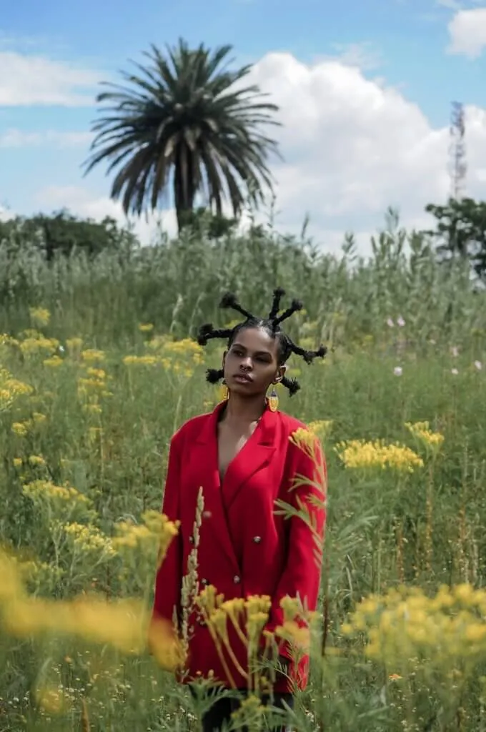 How To Unshare and Share Data On Glo 1 young woman in red coat standing in tropical meadow
