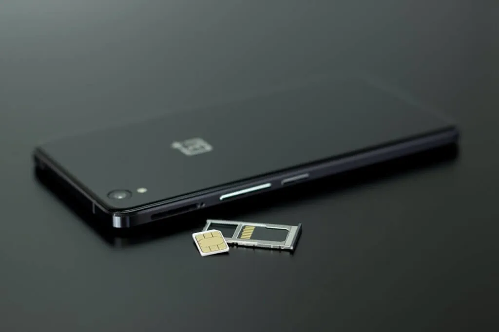 How To Activate Airtel eSIM 8 black smartphone on black table top