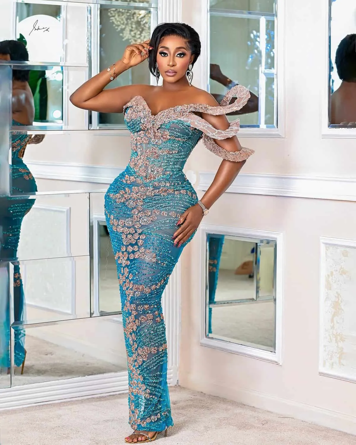 Ini Edo's Personal Projects and What to Expect from the Actor in 2025 3 Ini is wearing a beautiful blue lace outfit
